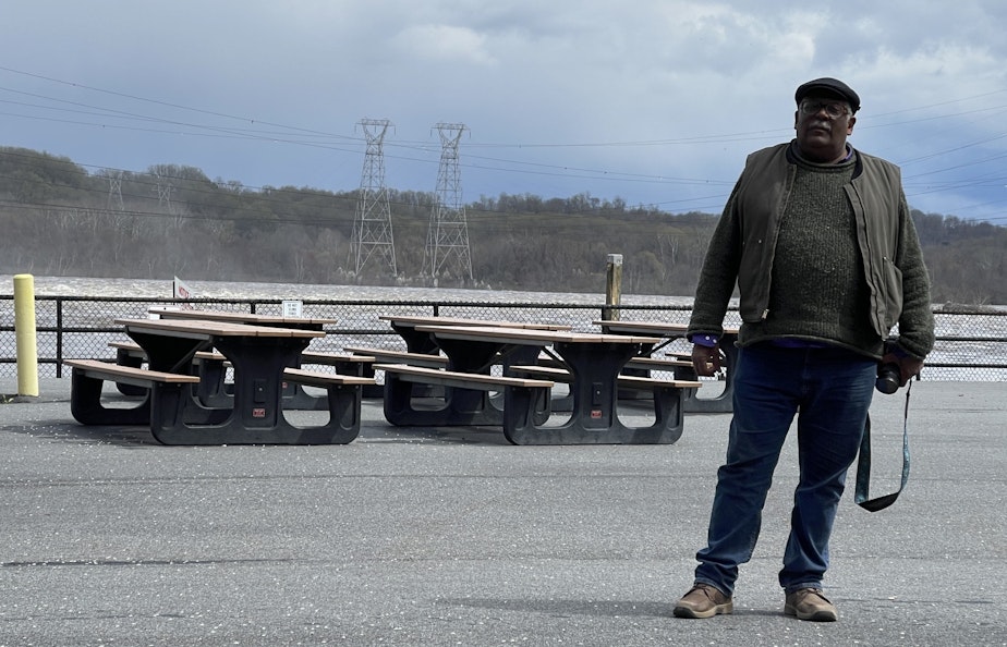 caption: Activist Fred Tutman with Patuxent Riverkeeper stands beside the Susquehanna River on April 4, 2024.