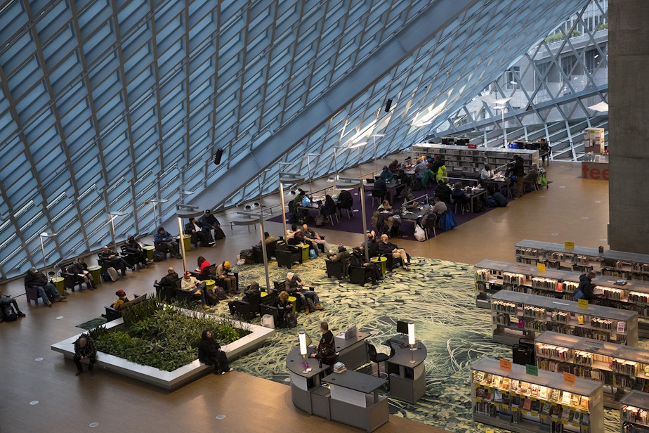 caption: Patrons are shown inside the Seattle Public Library Central branch on Thursday, Jan. 2, 2020, on Fourth Avenue in Seattle.