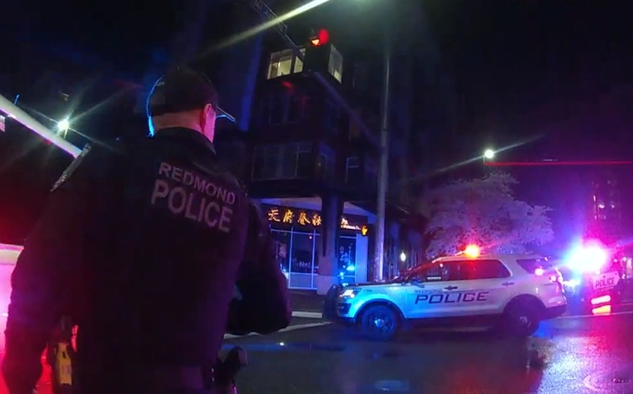 caption: Redmond police respond to a 911 call on March 22, 2024.
