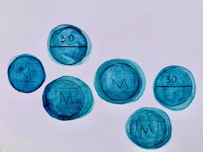 caption: An illustration of illegal fentanyl pills manufactured to look like legitimate oxycodone.