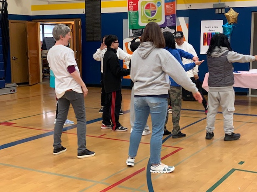 caption: Students and community members take part in a Move-A-Thon event March 10 at Aki Kurose Middle School to raise money for schools in Seattle's District 7.