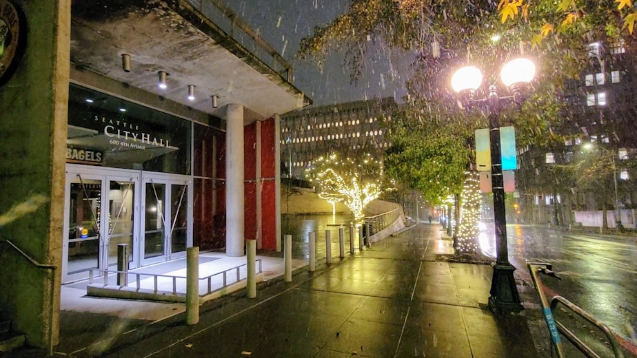 caption: Seattle City Hall during snowfall on Thursday, Jan. 11, 2024.