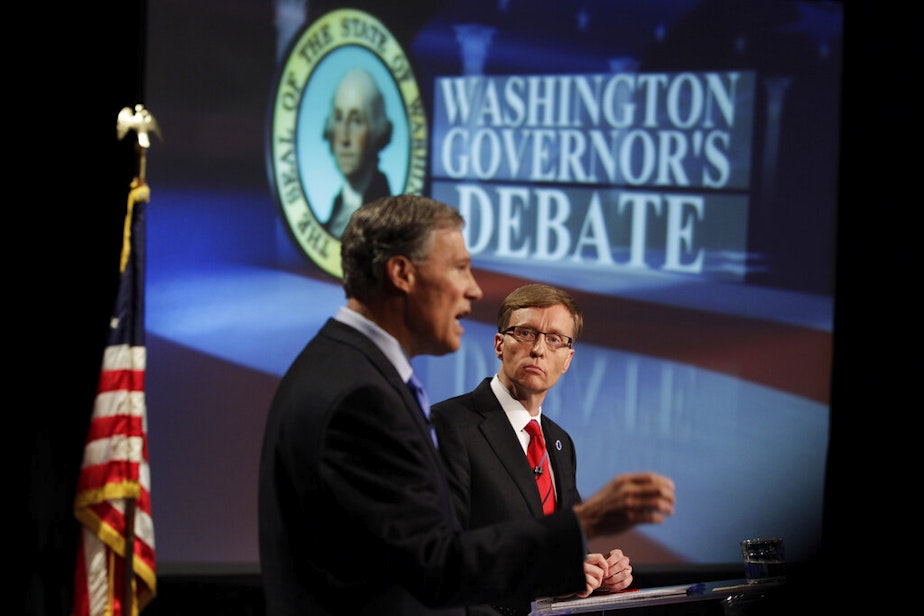 caption: Democratic candidate for Governor Jay Inslee, left, and Republican candidate Rob McKenna, right, take part in a gubernatorial debate, Thursday, Oct. 11, 2012, in Seattle.