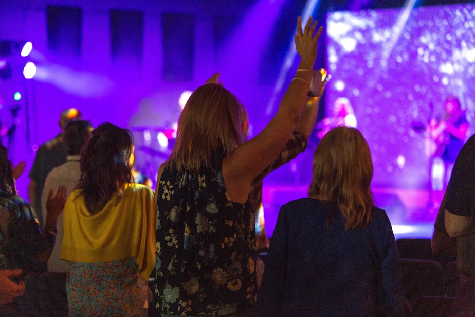 caption: Attendees worship at the Week of Awakening conference at Seattle Revival Center. The conference is linked to an August 2020 Covid outbreak with 28 cases and no deaths.