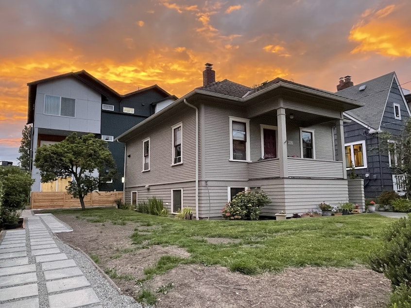 caption: A single-family home in Seattle's Greenwood neighborhood with infill housing in the backyard.