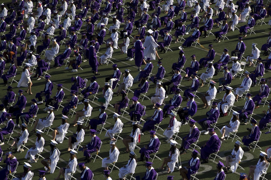 caption: Garfield High School seniors graduate in-person on Tuesday, June 15, 2021, at Memorial Stadium in Seattle.