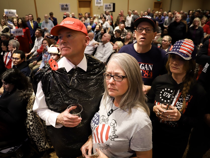 caption: Attendees at WAGOP Election Night Watch Party in Bellevue watch the screen as the election results are rolling in. Bellevue, November 5th 2024.