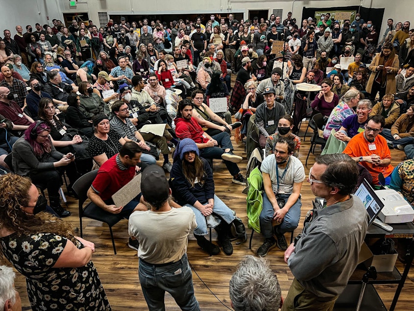 caption: Roughly 400 people packed the Martin Luther King FAME Community Center in Seattle’s Madison Valley on Dec. 7, 2023, to discuss a proposal for a playground structure at Denny Blaine Park. The proposal was ultimately struck down.