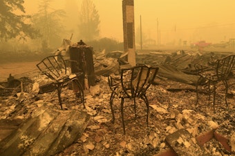 caption: Chairs stand at the local post office in the aftermath of a fire in Gates, Ore., on Sept 9, 2020. An Oregon jury on Tuesday awarded $85 million to nine victims of wildfires that ravaged the state in 2020, in the latest trial faced by utility PacifiCorp over its liability in the deadly blazes.