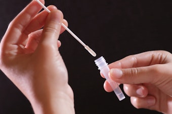 Using a COVID self-test.