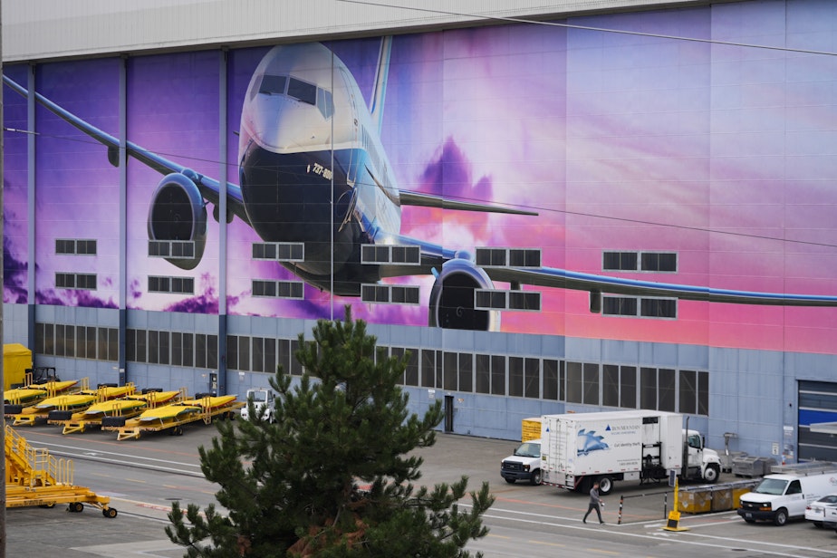 caption: A worker walks into Boeing's factory, Tuesday, Sept. 24, 2024, in Renton, Wash.