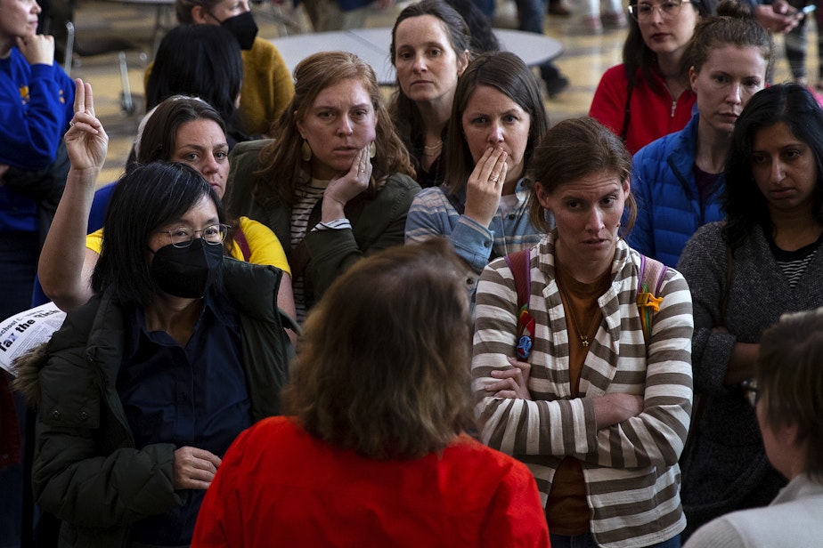 caption: Seattle parents address Seattle Public School officials after questions regarding the closure of 20 elementary schools were not allowed during a ‘Well Resourced-Schools Community Meeting,’ on Tuesday, May 28, 2024, at Roosevelt High School in Seattle.