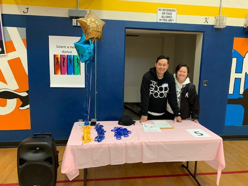 caption: May and Louie Praseuth of the Good Foot Arts Collective participate in a Move-A-Thon for the Southeast Seattle Schools Fundraising Alliance at Aki Kurose Middle School on March 10, 2023. The alliance partners with community organizations like Good Foot to raise funds for schools throughout District 7 in Southeast Seattle.