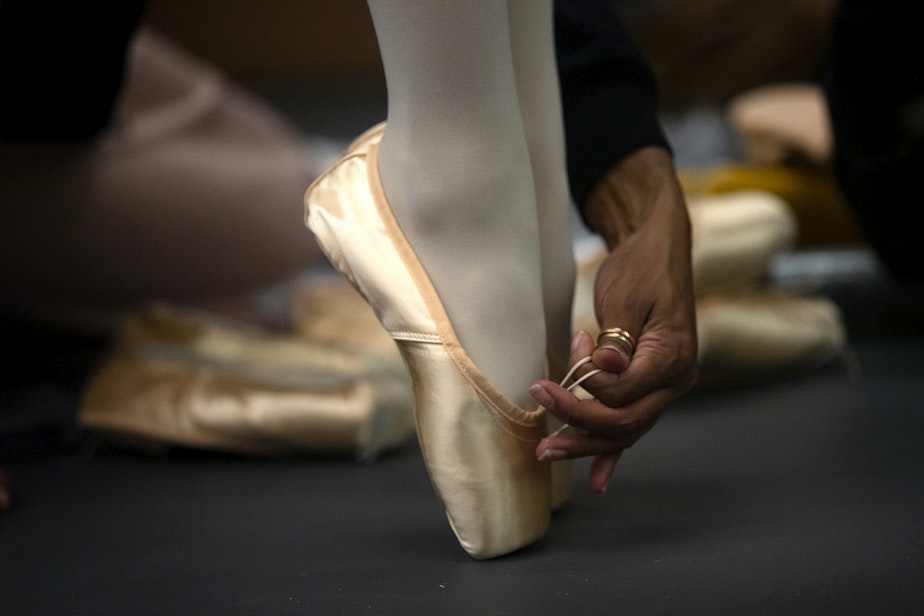 caption: Tess Chin, 12, has help from Kelsie Jones during a pointe shoe fitting on Tuesday, September 12, 2023, at the Pacific Northwest Ballet School in Bellevue.