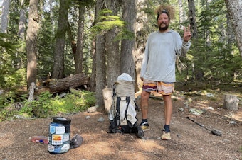 caption: Through-hiker Mike Campos breaking camp on the Pacific Northwest Trail in Olympic National Park on Sept. 2, 2023.