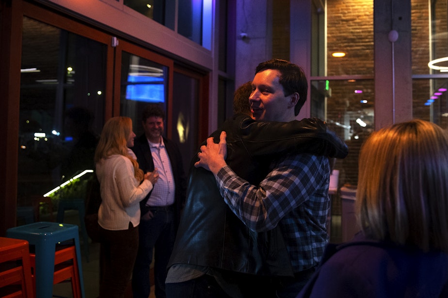 caption: Andrew Lewis, Seattle City Council incumbent in District 7, greets supporters during an election night party at Here Today Brewery and Kitchen on Tuesday, Nov. 7, 2023, in Seattle.