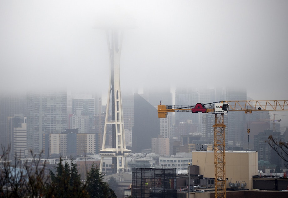 caption: A cloud hangs over downtown Seattle on Tuesday, November 21, 2017, shown from Kerry Park.