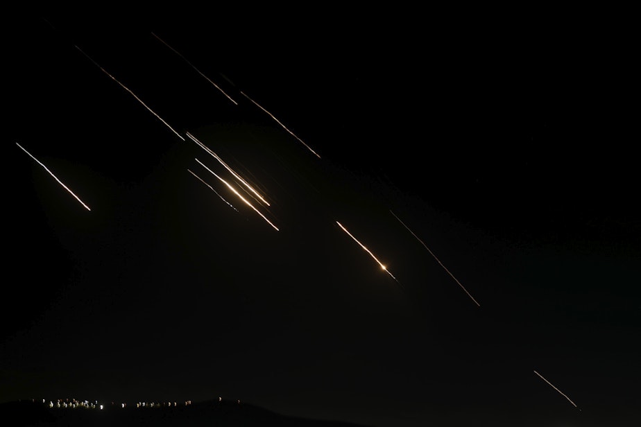 caption: Missiles launched from Iran towards Israel are seen in the West Bank city of Nablus Tuesday, Oct. 1, 2024.