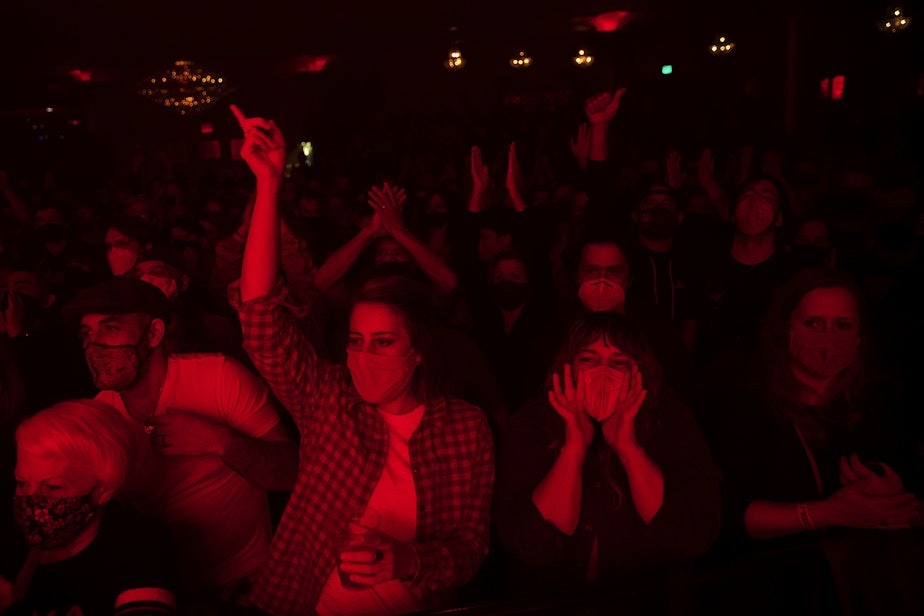 caption: Fans of Deep Sea Diver cheer as the band performs on Friday, November 12, 2021, at Showbox in Seattle.