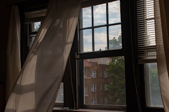 caption: Cracking a window can help reduce your risk of infection by COVID pathogens.
