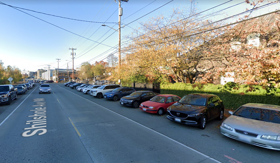 caption: A Google Street View image of the area where the body of a baby was found in the bushes.
